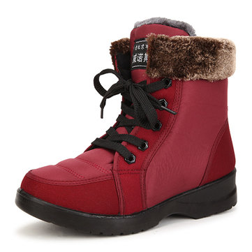 La nouvelle mode de femmes d'hiver épaississant du tissu cotonnier imperméable antidérapant garde des bottes de neige courtes chaudes